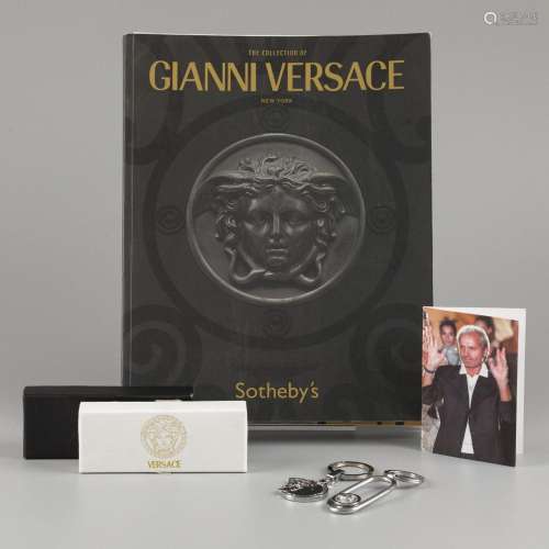 A lot consisting of two keyrings, a prayer card of Gianni Ve...
