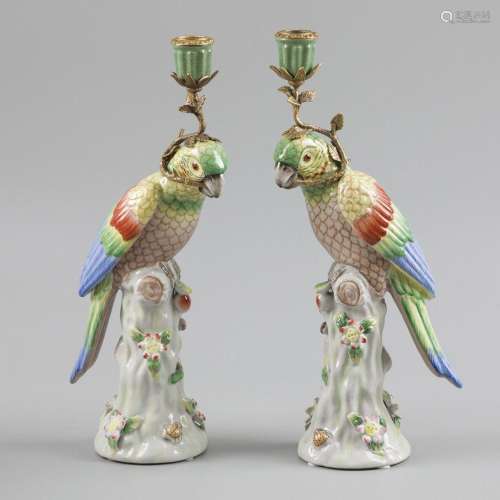 A set of two porcelain candlesticks in the shape of parrots ...