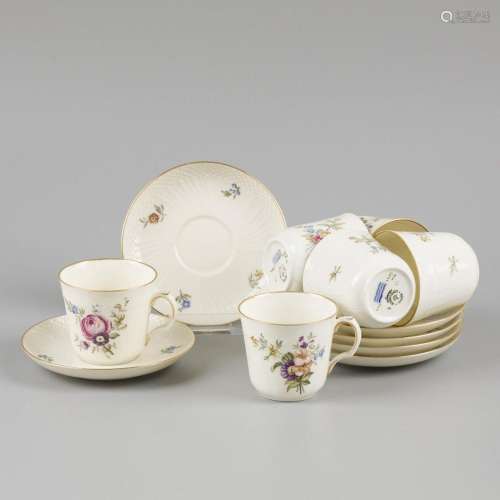 A set of (6) porcelain mocha cups and saucers decorated with...