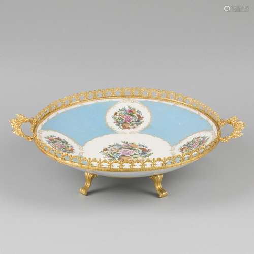 A porcelain table piece with floral decor. Limoges, late 20t...