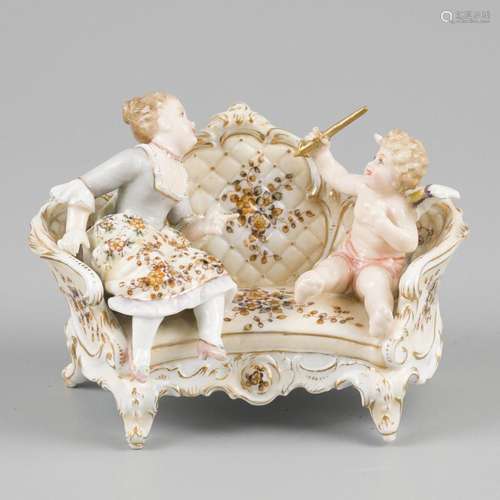 A porcelain group of and damen with puto on a bench. Richard...