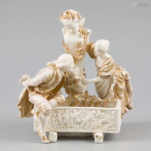 A porcelain group depicting a couple by a fountain. Kister &...