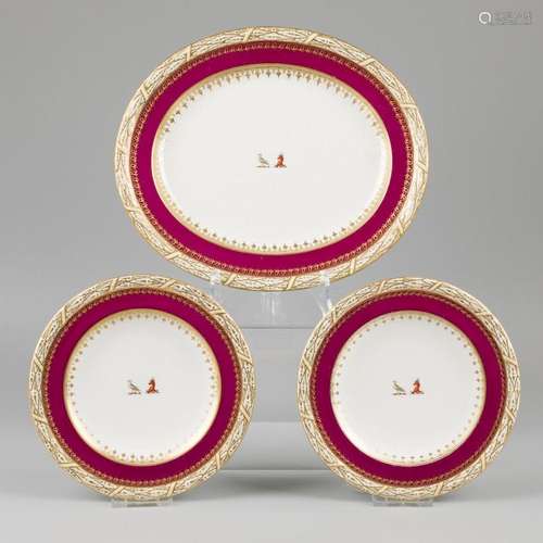 A lot consisting of two plates and a bowl decorated with ani...