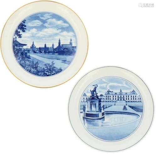 A lot with (2) porcelain plates decorated with cityscapes. M...