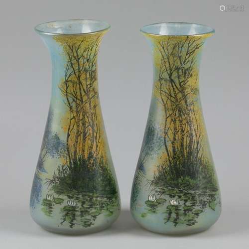 A set of (2) cold-painted glass vases decorated with a lands...