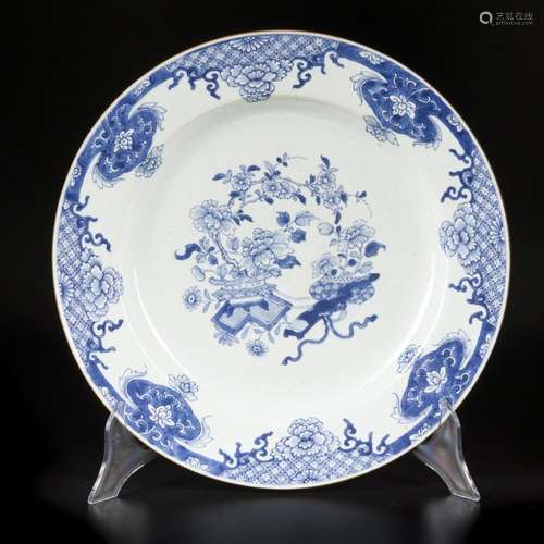 A porcelain dish decorated with antiques and flowers. China,...