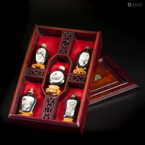 A collection of (5) wooden snuff bottles inlaid with bone pl...