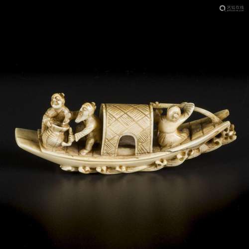 An ivory okimono of a gondola with figures on it. Japan, end...