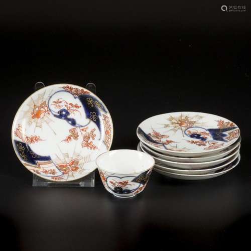 A lot of porcelain plates and a cup, all with Imari decorati...