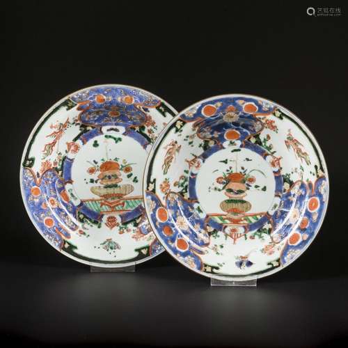 A set of (2) porcelain famille noir plates decorated with ph...