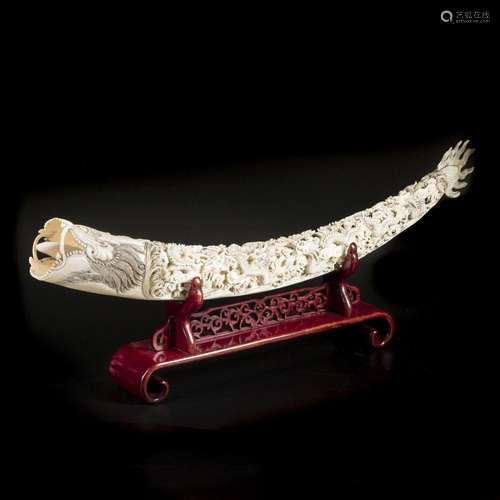 A large sculpted ivory tooth decorated with dragons. China, ...