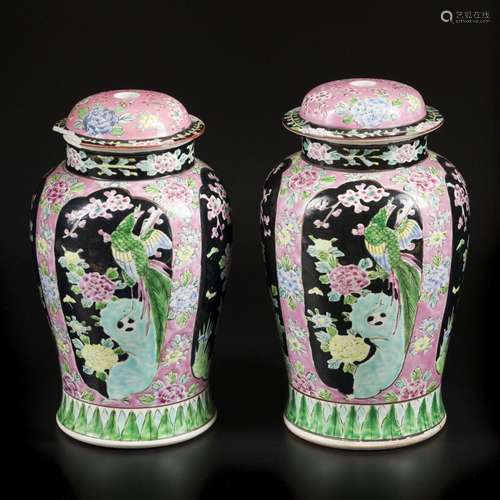 A set of (2) porcelain lidded vases with floral decoration. ...