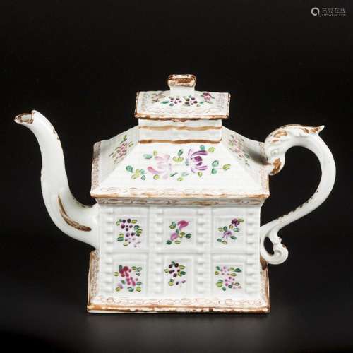 A porcelain famille rose teapot in the shape of a house. Eng...