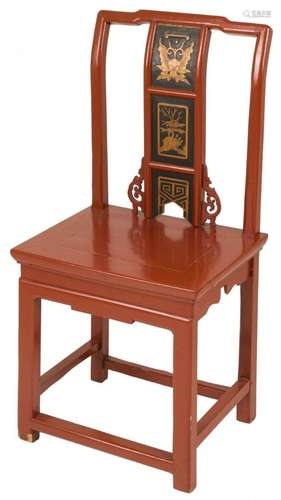 A red laquered Chinese chair.