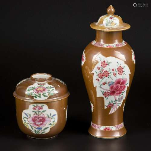 A porcelain famille rose lidded vase and lidded pot with cap...