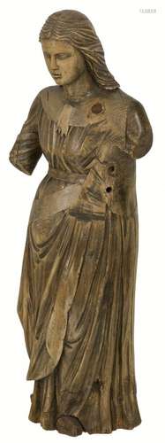 A fruitwood sculpture of a female figure, possibly a martyr,...