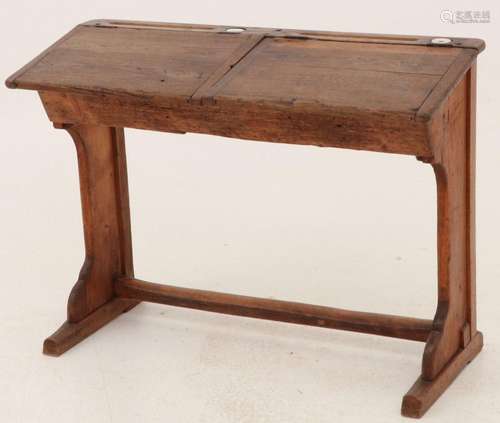 A pinewood, stained school desk for two, ca. 1920.