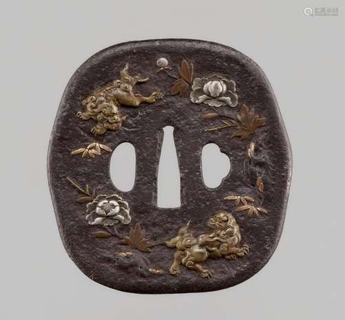 A VERY LARGE NARA SCHOOL TSUBA WITH SHISHI AND PEONIES, WITH...