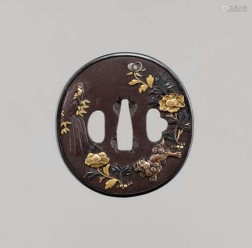 A FINE GOTO SCHOOL IRON TSUBA WITH SHISHI AND PEONIES