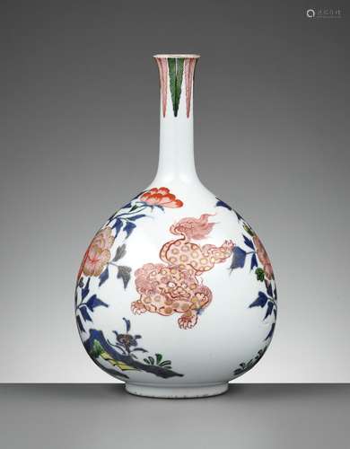 A RARE KO-IMARI BOTTLE VASE WITH SHISHI AND PEONY