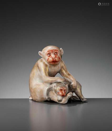 A PORCELAIN FIGURE OF A MONKEY AND YOUNG