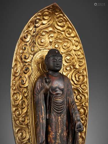 A LACQUER-GILT KAMAKURA WOOD FIGURE OF AMIDA NYORAI