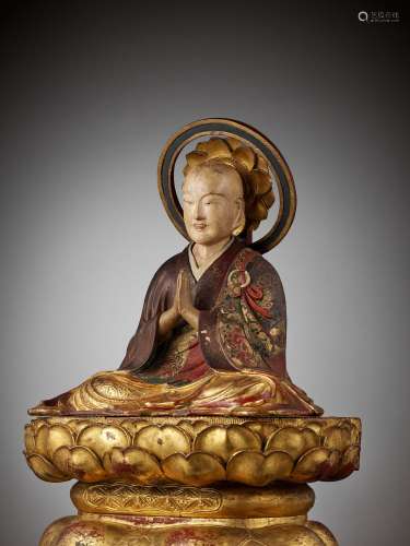 A POLYCHROME AND GILT-LACQUERED FIGURE OF A BUDDHIST MONK