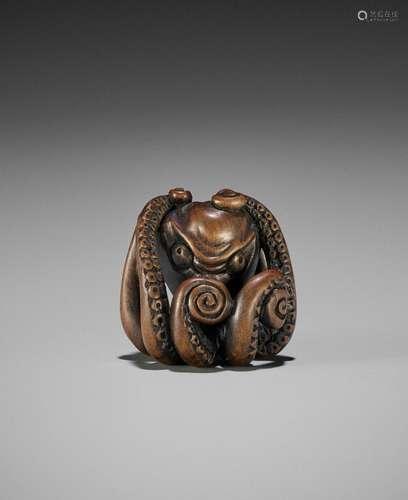 A WOOD NETSUKE OF AN OCTOPUS