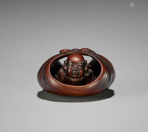 HOSHUNSAI MASAYUKI: A FINE WOOD NETSUKE OF HOTEI IN HIS TREA...