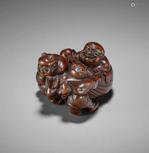 GENRYOSAI MINKOKU: A POWERFUL WOOD NETSUKE OF HOTEI WITH THR...