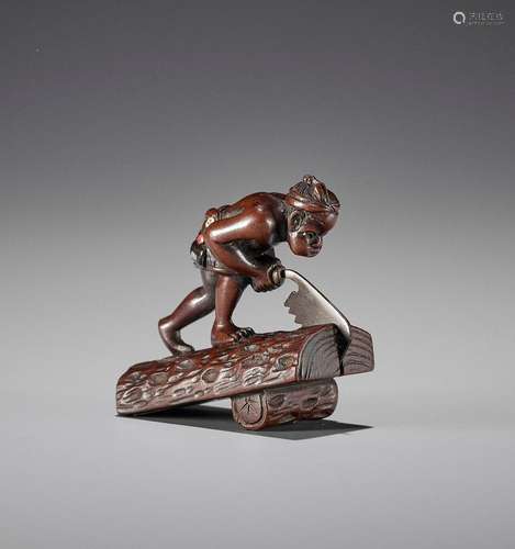 SHUNSAI: A FINE INLAID WOOD NETSUKE OF A CARPENTER