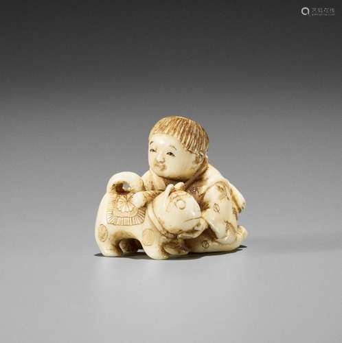 JUGYOKU: A CHARMING SMALL IVORY NETSUKE OF A BOY WITH DOG TO...