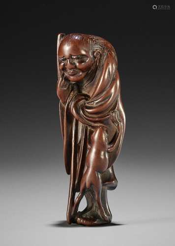 AN UNUSUAL WOOD NETSUKE OF GAMA SENNIN