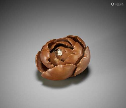 SHUBI: A WOOD NETSUKE OF A PEONY