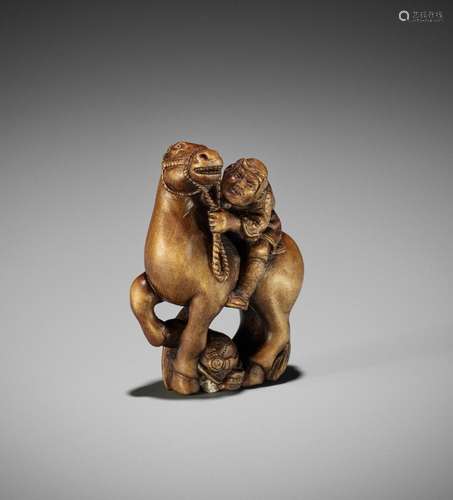 DERKACHENKO: A WOOD NETSUKE OF A WARRIOR ON HORSEBACK