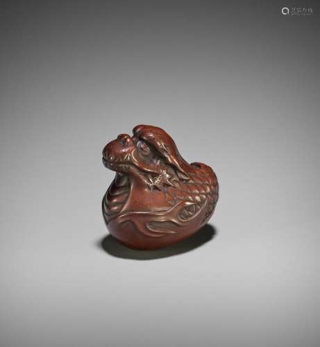 REIGEN: A WOOD NETSUKE OF A DRAGON HATCHLING