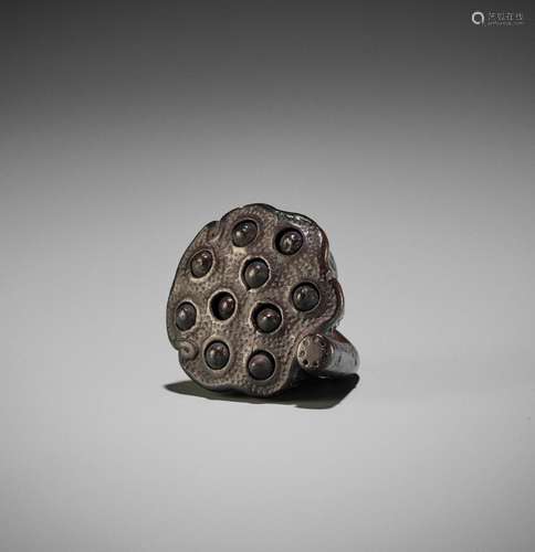 KOUN: A WOOD NETSUKE OF LOTUS POD WITH MOVABLE SEEDS