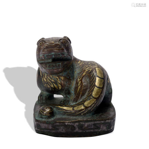 A bronze beast ware with gold and silver