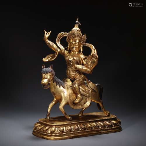 CHINESE BRONZE GILT RIDING BUDDHA STATUE, MING DYNASTY