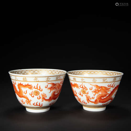 A PAIR OF CHINESE RED-PAINTED GOLD CUPS FROM THE QING DYNAST...