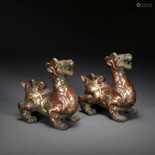 A PAIR OF CHINESE BRONZE BEAST INLAID WITH GOLD AND SILVER, ...