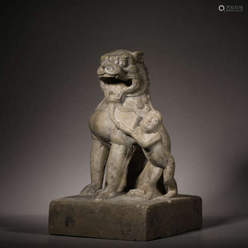 Sitting stone lion statue