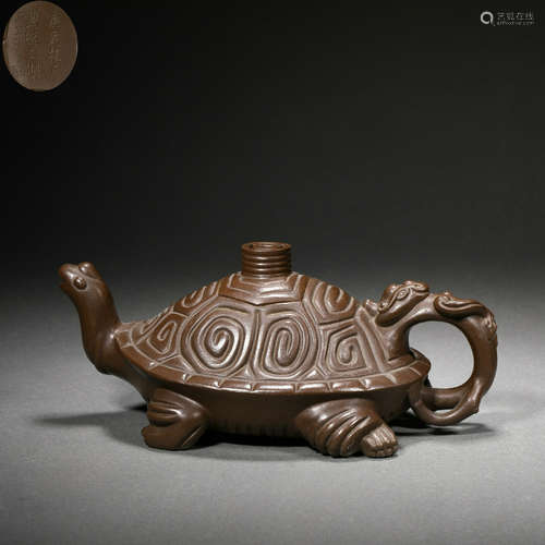 Turtle-shaped purple clay teapot