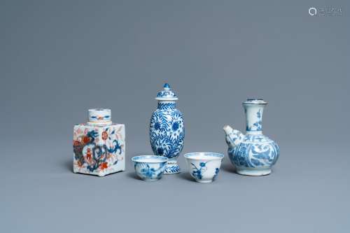 TWO CHINESE BLUE AND WHITE CUPS, A COVERED VASE, A KENDI AND...