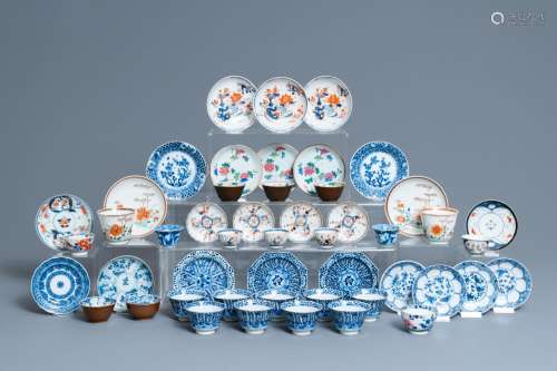 TWENTY-FOUR CHINESE CUPS AND TWENTY-FIVE SAUCERS IN BLUE AND...