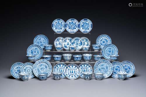 TWENTY CHINESE BLUE AND WHITE SAUCERS AND NINETEEN CUPS, KAN...