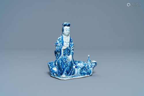 A CHINESE BLUE AND WHITE FIGURE OF A SEATED GUANYIN, 19TH C.