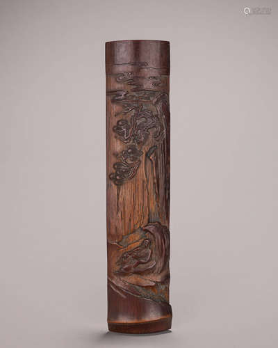 A carved bamboo arm rest