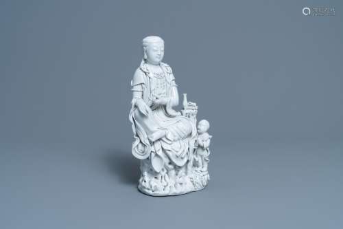 A CHINESE DEHUA BLANC DE CHINE FIGURE OF GUANYIN, HE CHAOZON...