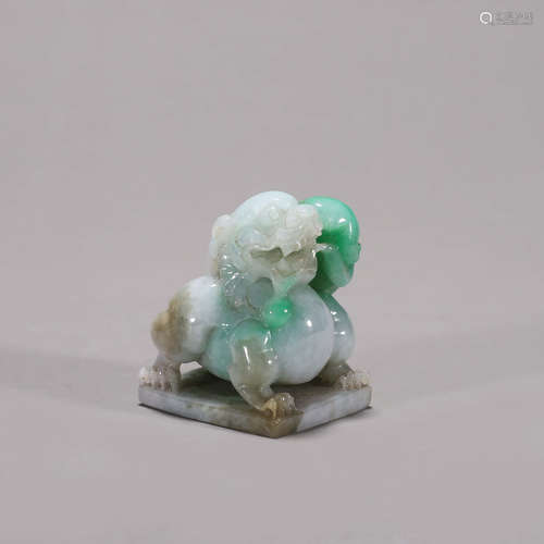 A jadeite lion paperweight